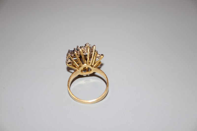 A modern 18ct gold, sapphire and diamond raised cluster dress ring, size N, gross 7.4 grams.